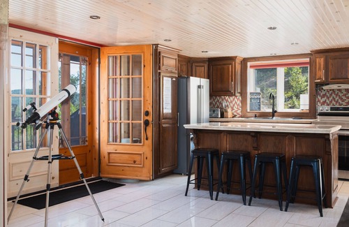 Mandeville Cabin | Charming log cabin nestled in the woods, with a spa and in-ground pool.