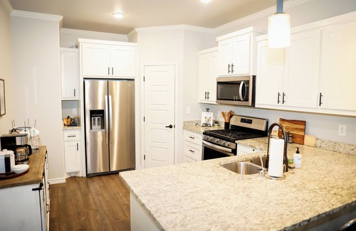 Midland House | Charming retreat nestled in a peaceful neighborhood & conveniently located!