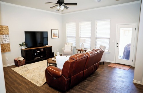 Midland House | Charming retreat nestled in a peaceful neighborhood & conveniently located!