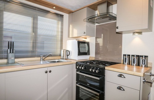 Chichester Cottage | CHICHESTER LAKESIDE HOLIDAY PARK, pet friendly in Chichester