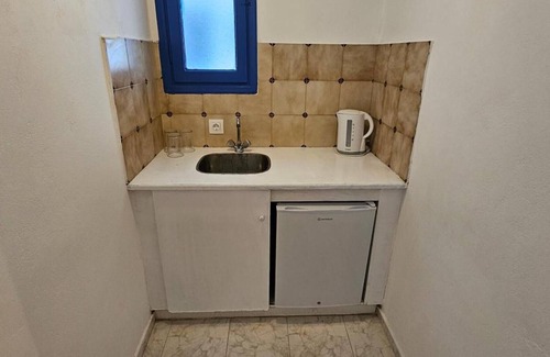 Perissa Apartment | Classic Quadruple Room 1 with Balcony and Air Conditioning