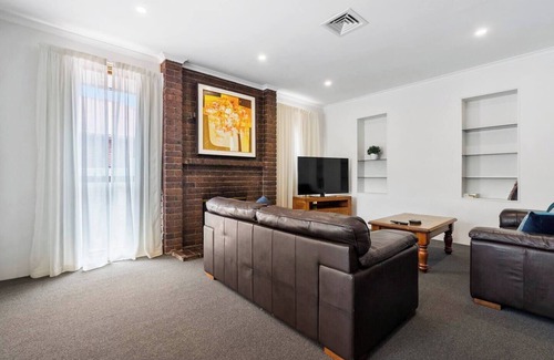 Sandy Bay House | Classic Retro Home Steps from Sandy Bays Best