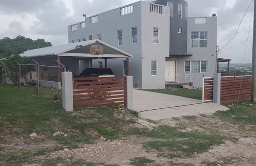 Saint John Parish Cottage | close to the city, supermarkets, beaches & views of the city when you're outside