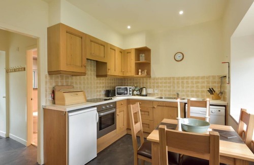 Slate Islands Cottage | Coachmans Cottage - a delightful mews cottage with enclosed garden