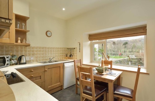 Slate Islands Cottage | Coachmans Cottage - a delightful mews cottage with enclosed garden