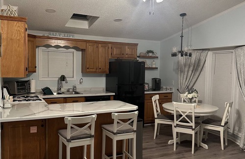 Assateague Pointe House | Coastal Cottage - 2BR Home with 2 Pools, pond, & 1000ft pier in Assateague Point