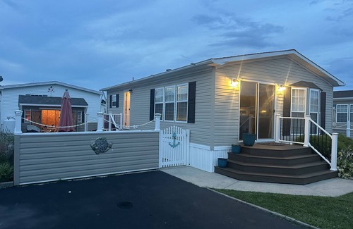 Assateague Pointe House | Coastal Cottage - 2BR Home with 2 Pools, pond, & 1000ft pier in Assateague Point