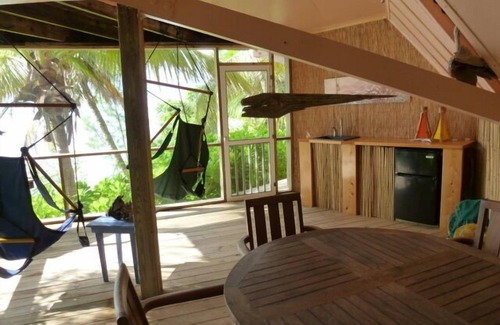 Green Turtle Cay Cottage | Coco Nut Tree House is nestled in Tropical Foliage on Crystal Clear Sea of Abaco