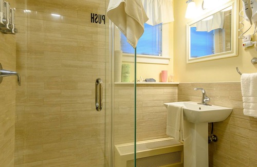 Stowe Bed & Breakfast | Comfortable budget room with queen bed, street view, and all-glass shower stall with full service breakfast included