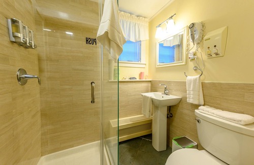 Stowe Bed & Breakfast | Comfortable budget room with queen bed, street view, and all-glass shower stall with full service breakfast included