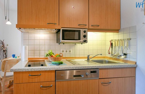 Neuensien Apartment | Comfortable vacation apartment with lake view and conservatory in the Seedorf vacation park