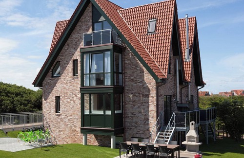 Juist House | Comfortable vacation home Juist: dune view, 5 bedrooms, 4 bathrooms, guest WC, fireplace, barbecue