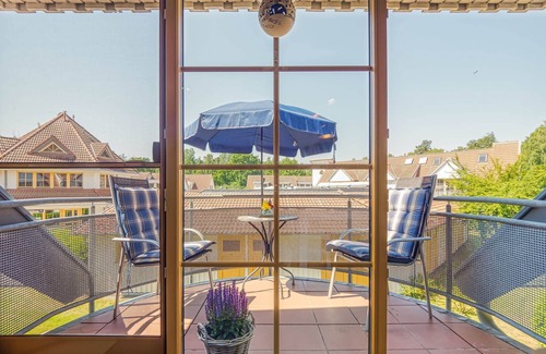 Zingst Apartment | Comfortable Windrose vacation apartment with balcony, pool and garden view in Zingst