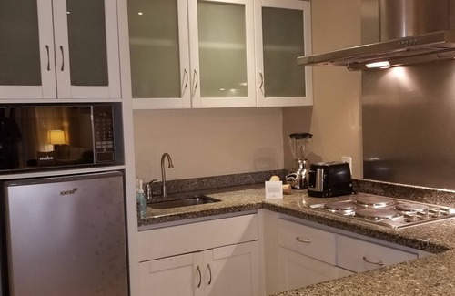 Villa Juarez Resort | Condo, with Jacuzzi and mini pool at porch. A beach nearby with lot of amenities