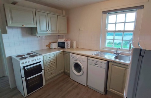 Corofin Cottage | Corofin Lake Cottage No 4 - a two story that sleeps 6 guests in 3 bedrooms