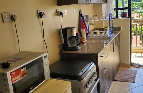 Nairobi Apartment | Cozy 1BR Retreat with Pool, Gym & WiFi in Leafy Serene Kitisuru, Nairobi