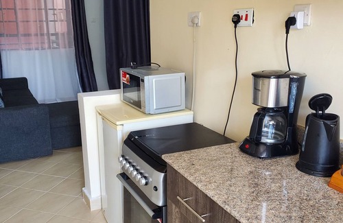 Nairobi Apartment | Cozy 1BR Retreat with Pool, Gym & WiFi in Leafy Serene Kitisuru, Nairobi