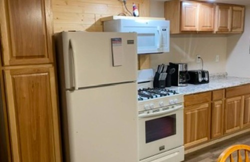 Rudyard Cabin | Cozy 2-bedroom cabin near endless trails. Family and pet friendly. Fire pit & AC