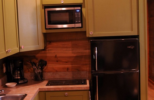 New Braunfels Cabin | Cozy Cabins near the Comal River- Cabin #2- Military Theme. Walk to Wurstfest