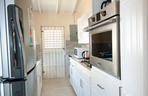 Fitts Village House | Cozy Caribbean Getaway across from Beach