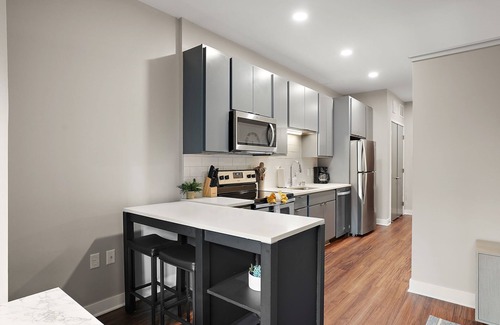 Downtown Minneapolis Apartment | CozySuites Marquee | pool, gym #01