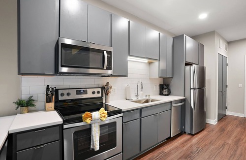 Downtown Minneapolis Apartment | CozySuites Marquee | pool, gym #01