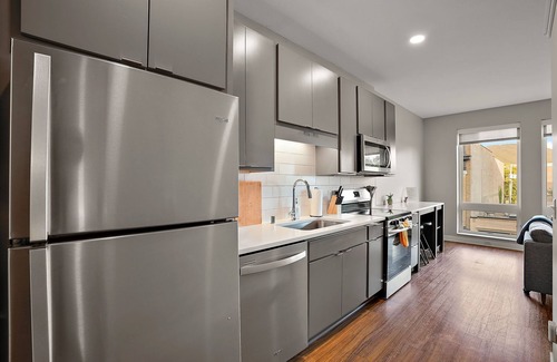 Downtown Minneapolis Apartment | CozySuites Marquee | pool, gym #02