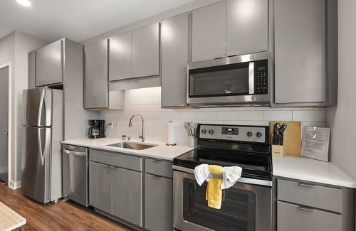 Downtown Minneapolis Apartment | CozySuites Marquee | pool, gym #03