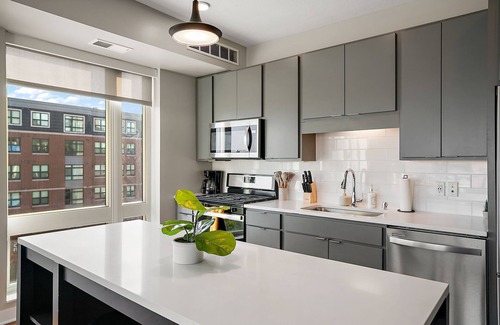 Downtown Minneapolis Apartment | CozySuites Marquee | pool, gym #04