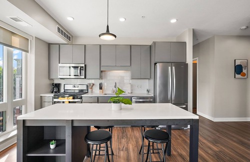 Downtown Minneapolis Apartment | CozySuites Marquee | pool, gym #04