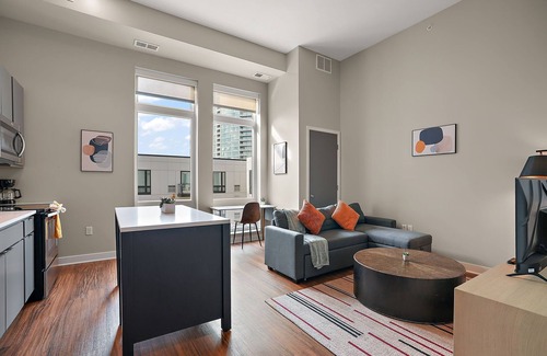 Downtown Minneapolis Apartment | CozySuites Marquee | pool, gym #05