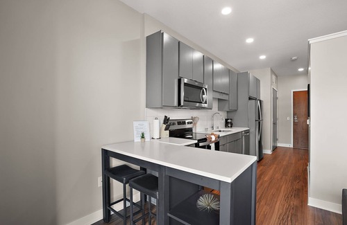 Downtown Minneapolis Apartment | CozySuites Marquee | pool, gym #06