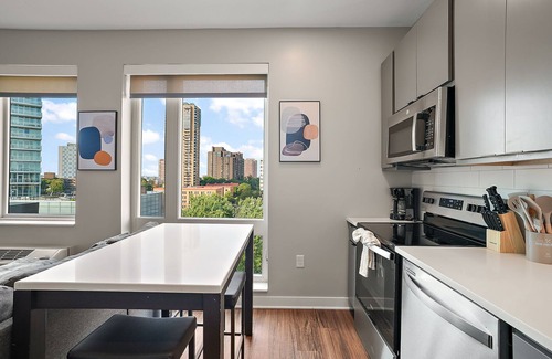 Downtown Minneapolis Apartment | CozySuites Marquee | pool, gym #07