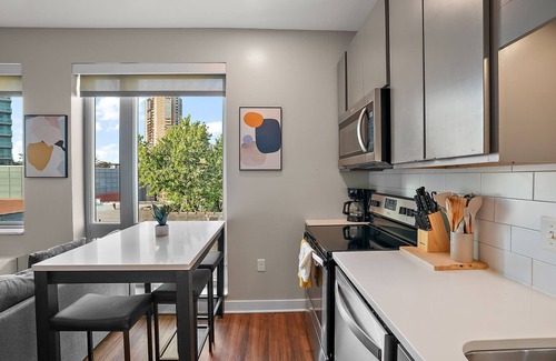 Downtown Minneapolis Apartment | CozySuites Marquee | pool, gym #09