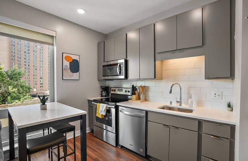 Downtown Minneapolis Apartment | CozySuites Marquee | pool, gym #09