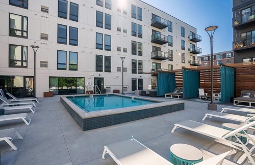 Downtown Minneapolis Apartment | CozySuites Marquee | pool, gym #09