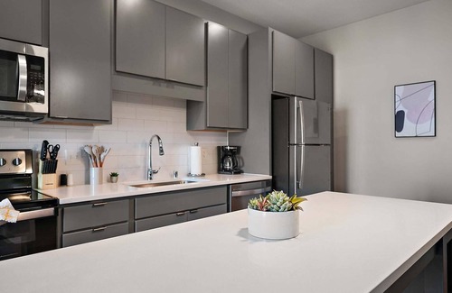 Downtown Minneapolis Apartment | CozySuites Marquee | pool, gym #10