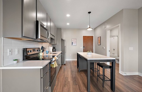 Downtown Minneapolis Apartment | CozySuites Marquee | pool, gym #10