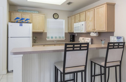 South Padre Island Condo | Cute Coastal Condo with Sparkling Pool! Walk to Beach in minutes!