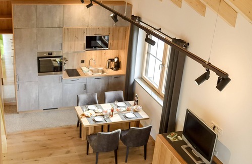 Muenchberg Apartment | Design apartment with gallery and reading corner