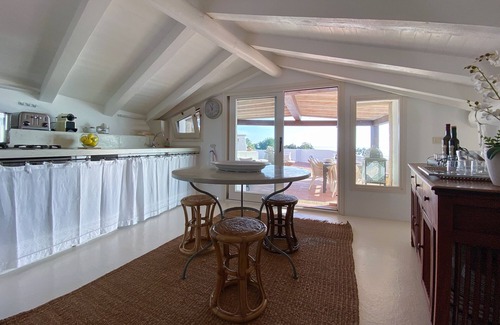 Porto Rotondo Apartment | Designer apartment overlooking the bay. Shared pool, access to the sea