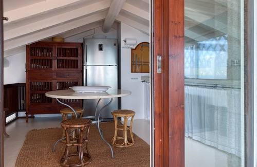 Porto Rotondo Apartment | Designer apartment overlooking the bay. Shared pool, access to the sea