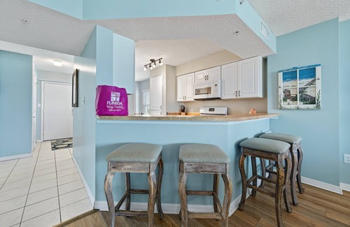 Seawinds Condo Condo | Direct oceanfront corner condo with large balcony, beachfront pool, and garage parking