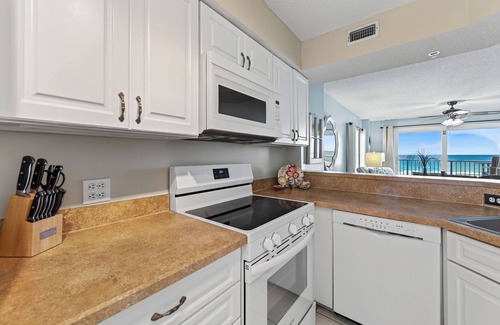 Seawinds Condo Condo | Direct oceanfront corner condo with large balcony, beachfront pool, and garage parking