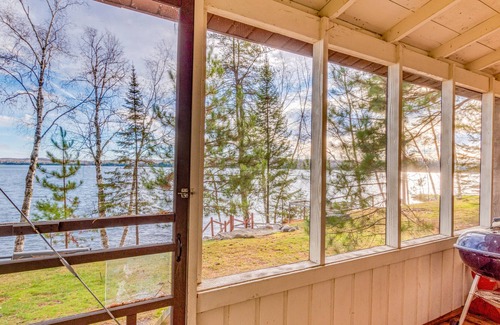 Presque Isle Cabin | Dog-friendly lakefront cabin with on-site swimming, fishing, & rec room