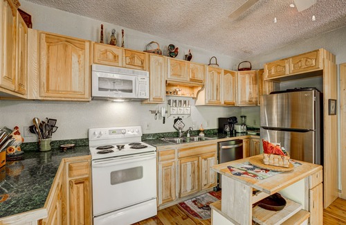 Wiley Cabin | Dog-friendly riverfront cabin with waterfall view, large decks, firepit, Ping-Pong