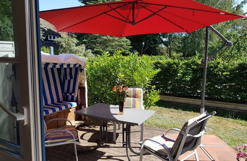 Wieck auf dem Darss Apartment | Don't rush me - modern ground floor apartment with south-facing terrace & beach chair in Wieck a. Darß