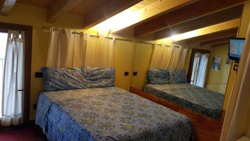 Sud-Ovest House | Dora Baltea Monolocale primo piano Mansarda secondo piano