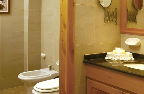 San Carlos de Bariloche Hotel | Elegant Nahuel Huapi Retreat – Spacious Room w/Lake and Garden Views Nearby