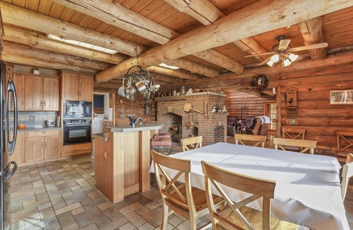 Summit Station Cabin | Enchanted log cabin with lake view